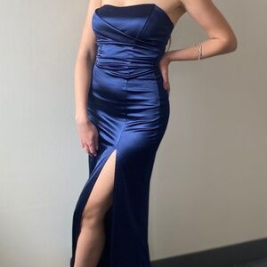 Strapless navy maxi dress with a slit.